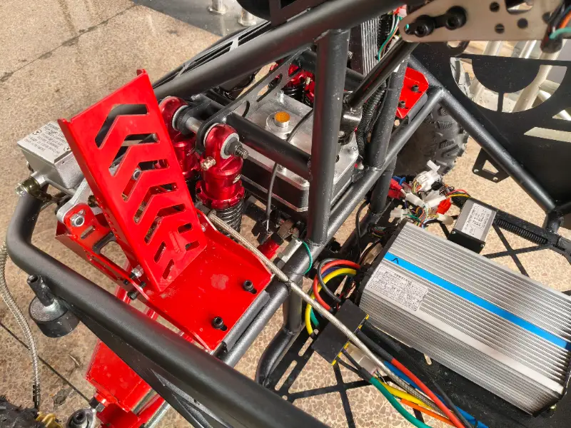 All-terrain suspension kart showing independent front suspension and frame structure